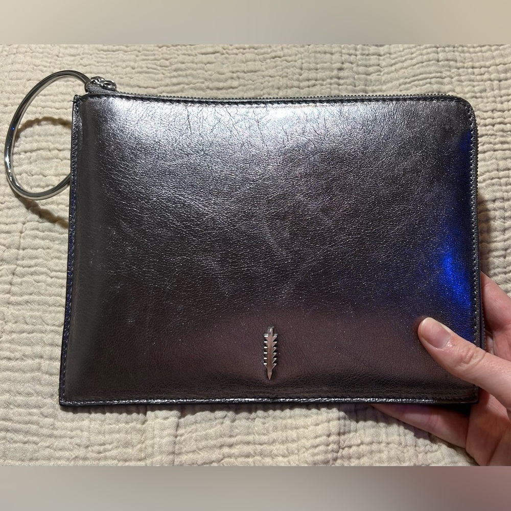 Thacker silver clutch with wrist ring
